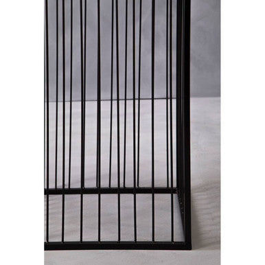 Black metal cage with vertical bars and rectangular frame in alden floor standing planter for stylish greenery display