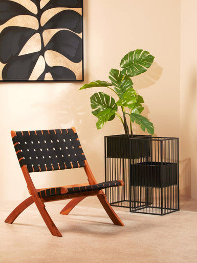 Wooden-framed alden floor standing chair with black woven leather straps perfect for stylish floor standing planter spaces