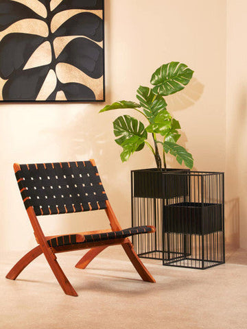 Wooden-framed alden floor standing chair with black woven leather straps perfect for stylish floor standing planter spaces