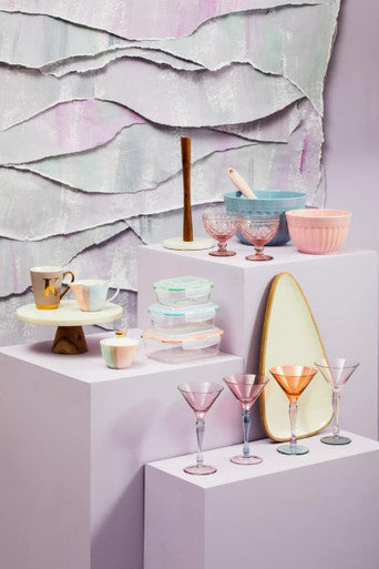 Pastel pink and gold gradient glass martini glasses with slender stems shown alongside alden melamine extra large blue mixing bowl