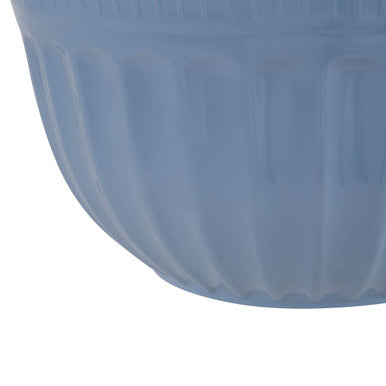 A translucent light blue ribbed alden melamine extra large mixing bowl with a smooth slightly glossy finish