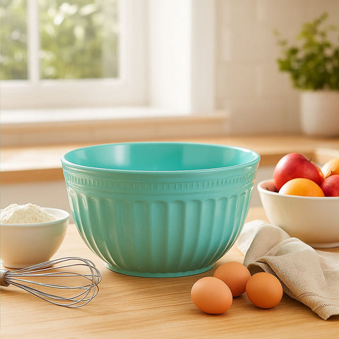 A teal aldren melamine extra large green mixing bowl with ribbed texture and glossy finish on a wooden countertop