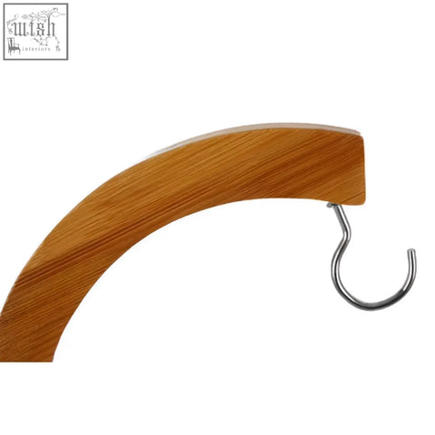 Light brown bamboo banana hanger hook with silver wire loop for hanging bananas in the aleki bamboo banana hanger
