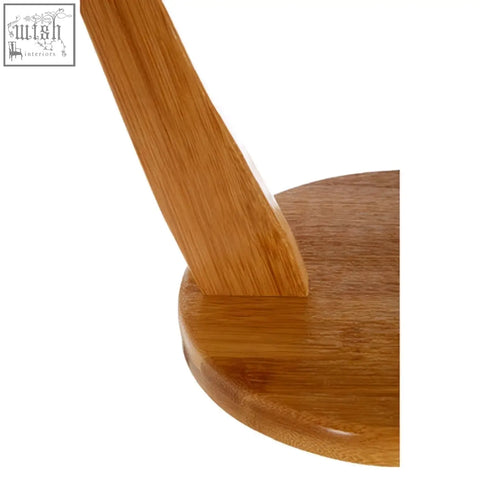 A sleek light brown bamboo banana hanger leg with smooth finish and visible grain pattern for bananas