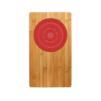 Red silicone mat with dot pattern on aleki bamboo chopping board for easy bamboo chopping and prep tasks