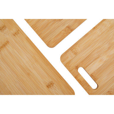 Light brown aleki set of three bamboo chopping and serving boards with natural wood grain and oval handle cutout