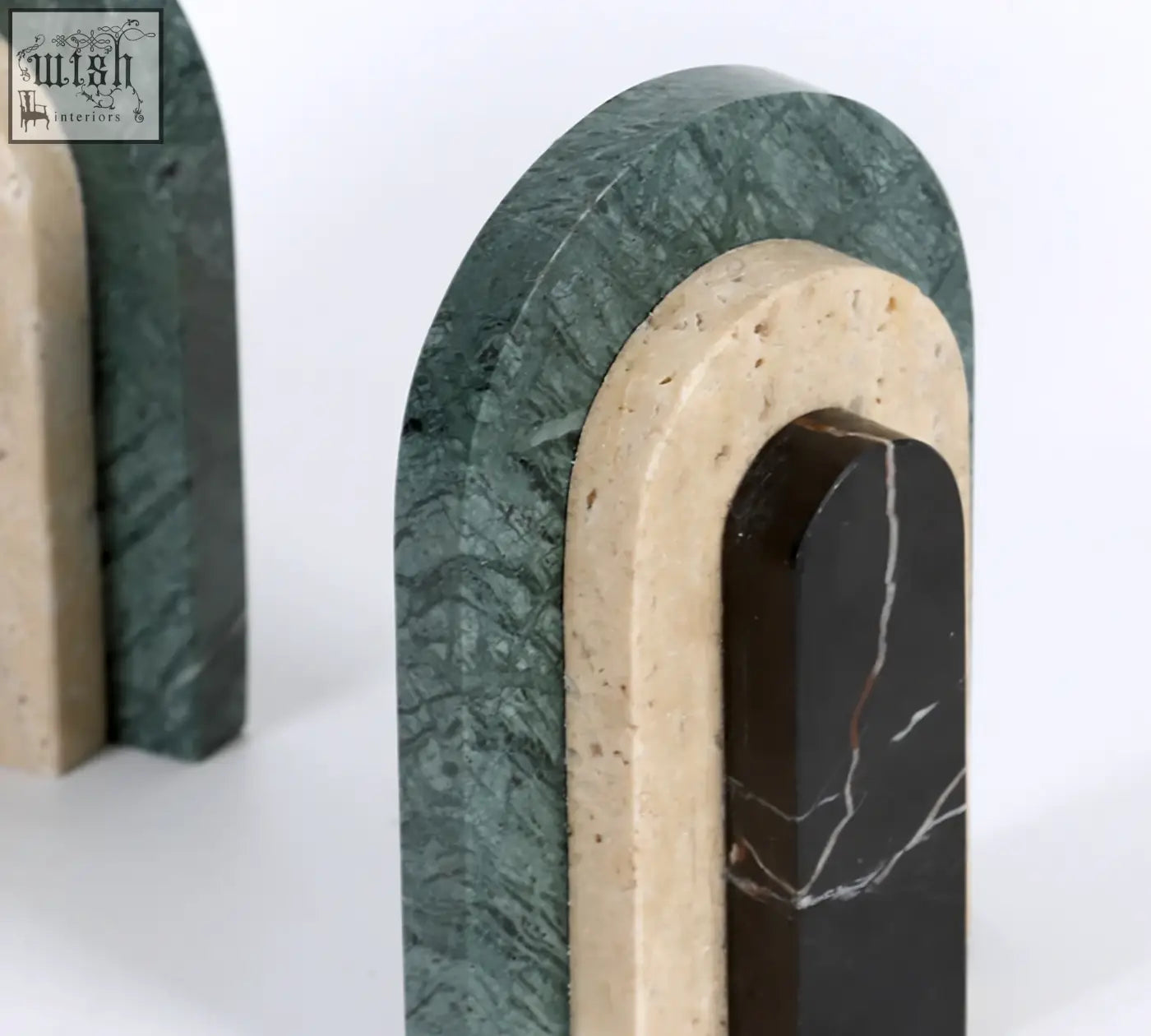Alexis stone bookends in green beige and black marble with a layered arch design perfect stone bookends