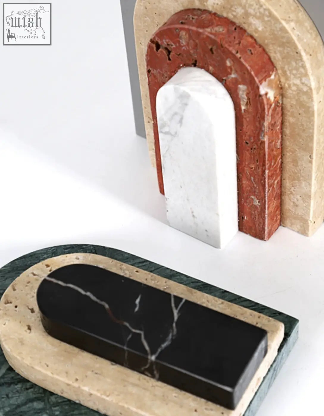 Set of three alexis stone bookends in terracotta white marble and black marble with beige stone bases for shelves