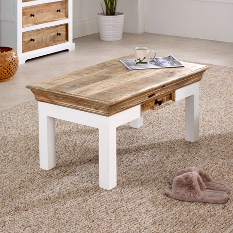 Rustic alfie coffee table with drawer made of solid mango wood featuring a light wood top and white legs
