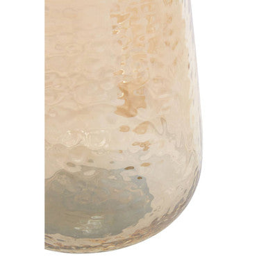 A translucent amber allegra bathroom glass tumbler with hammered texture and subtle golden highlights