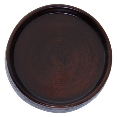 Dark brown wooden circular soap dish with allegra bronze finish and polished surface with subtle ring patterns