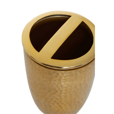 Allegra hammered effect toothbrush holder in gold tone with hammered metal and a circular top featuring an open z cutout