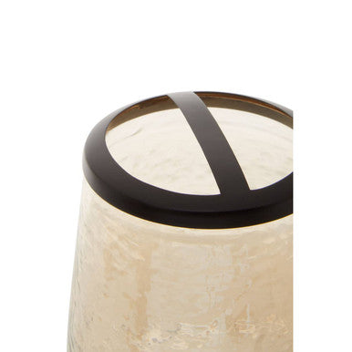 Beige allegra textured glass toothbrush holder with sleek black metal rim and cross-shaped accent detail