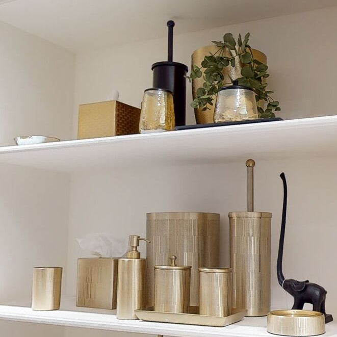 Gold-toned allegra textured glass toothbrush holder with vertical ribbed texture and brushed metallic finish