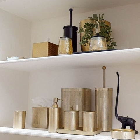 Gold-toned allegra textured glass toothbrush holder with vertical ribbed texture and brushed metallic finish