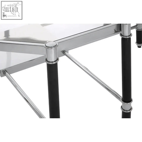 Allessi silver metal coffee table with black legs and clear glass top for modern living rooms
