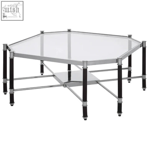 Octagonal allessi coffee table with clear glass top silver metal frame and black legs for modern living rooms