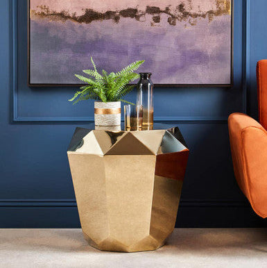 Geometric champagne gold diamond cut end table with a faceted gold diamond finish and angular design