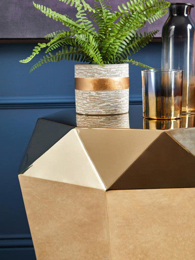 Allure champagne gold diamond cut end table with a textured beige and gold diamond planter and lush green fern