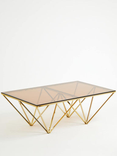 Allure champagne metal prismatic legs coffee table with gold-toned geometric frame and amber glass top