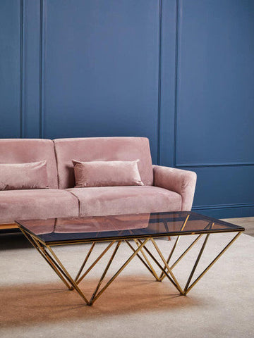Modern geometric coffee table with black glass top and allure champagne metal prismatic legs frame