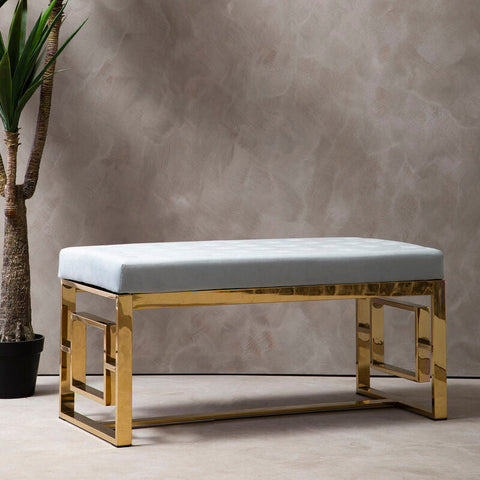 Gold metal frame bench with a light blue powder grey tufted seat from the allure powder grey collection