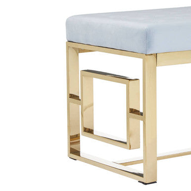 Light blue upholstered bench with a sleek gold metal frame in allure powder grey tufted design