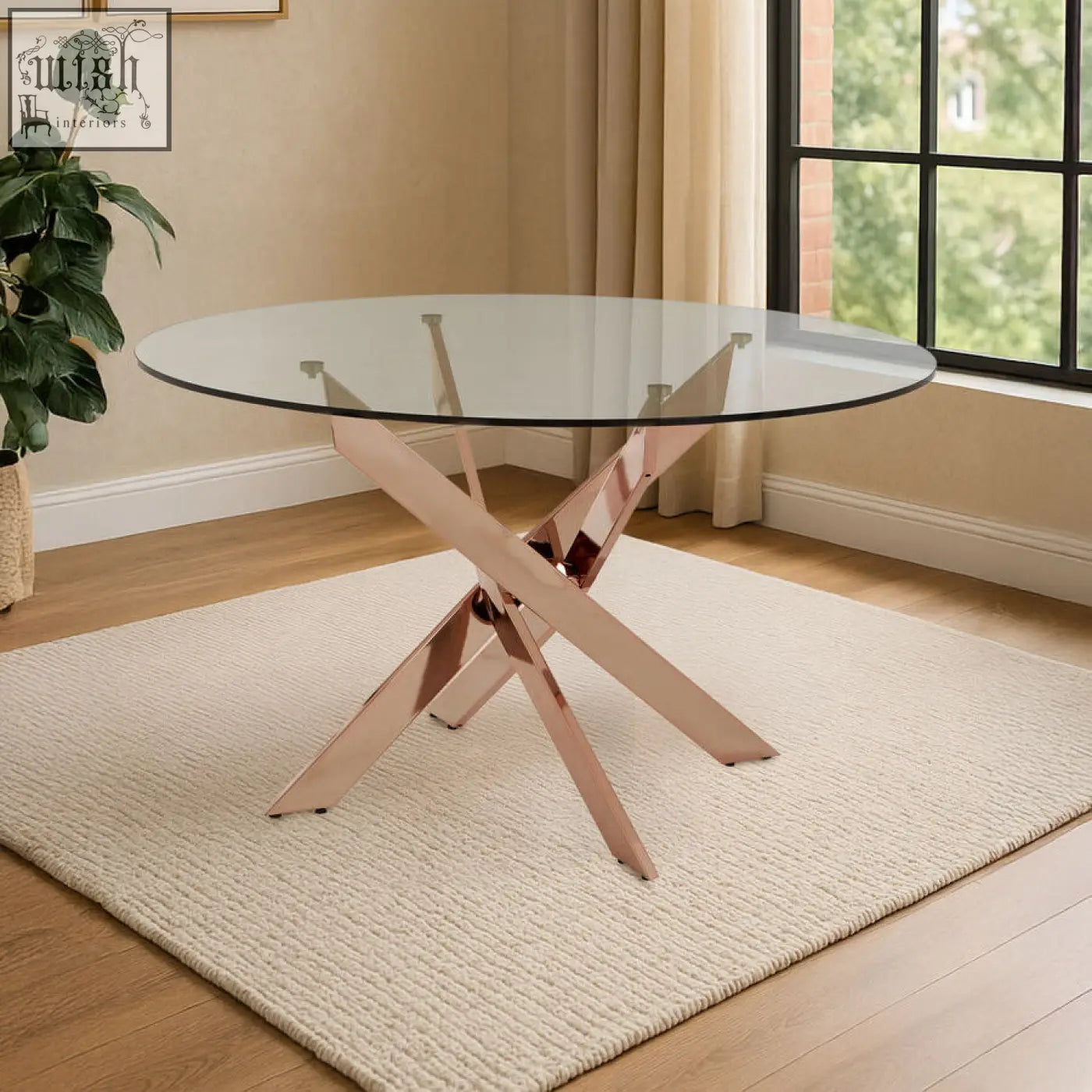 Allure round dining table with intersected rose gold x-shaped metal base and clear glass tabletop