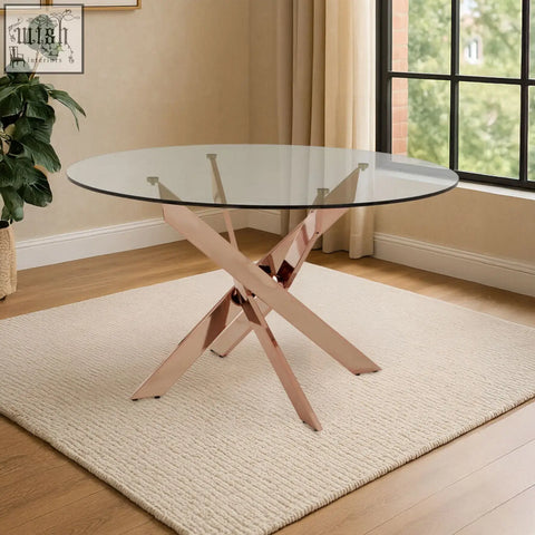 Allure round dining table with intersected rose gold x-shaped metal base and clear glass tabletop