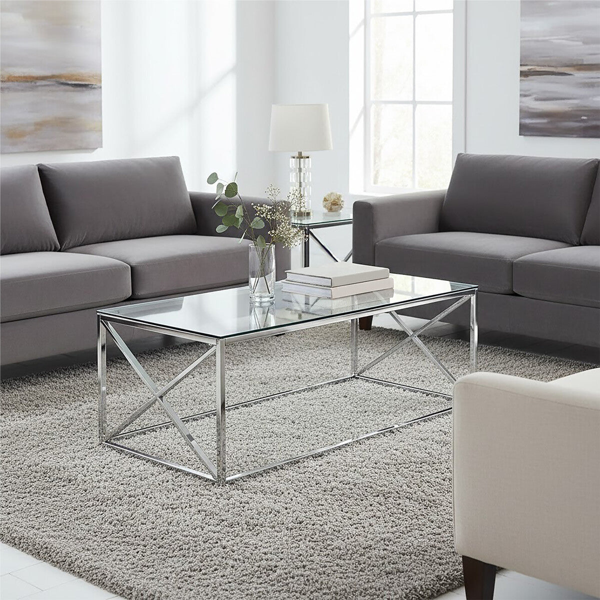 Modern allure silver cross coffee table with clear glass top and sleek silver cross chrome metal frame and x-shaped base