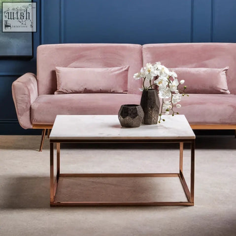 The allure square rose gold coffee table features a sleek white marble top with elegant rose gold metal legs and frame