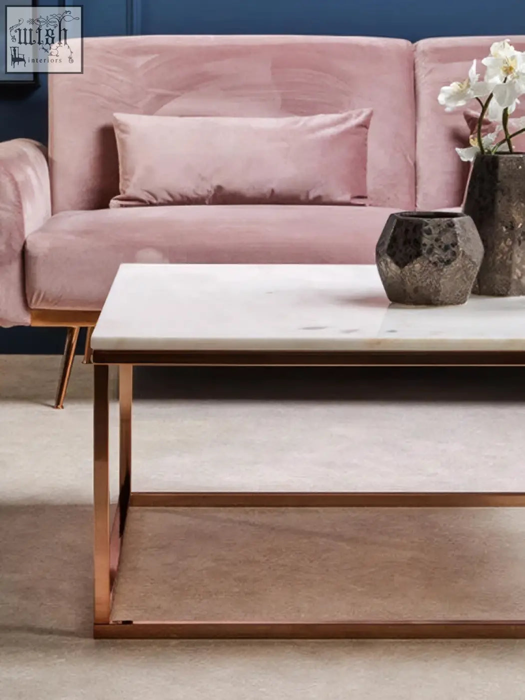 The allure square rose gold and marble coffee table features a sleek white marble top with rose gold metal legs and frame