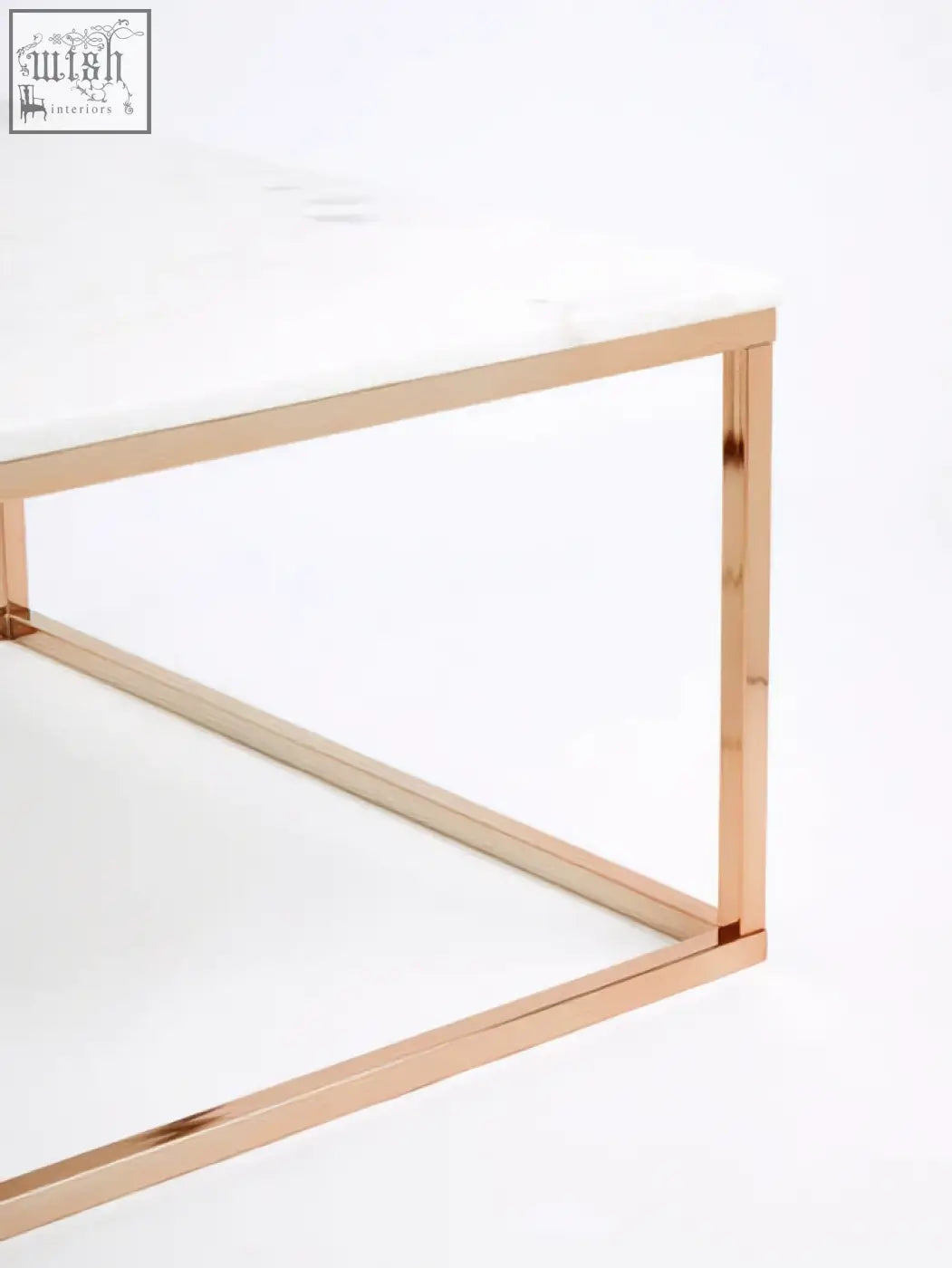 A sleek square rose gold coffee table with a white marble top perfect for modern living spaces