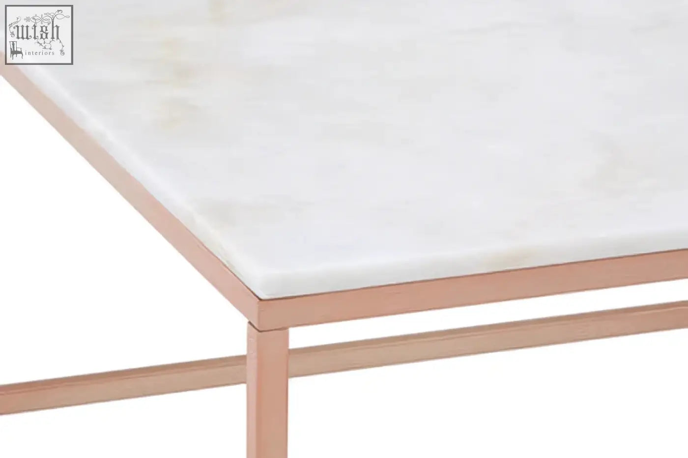 A sleek white marble coffee table with a square rose gold metal frame perfect for modern living spaces