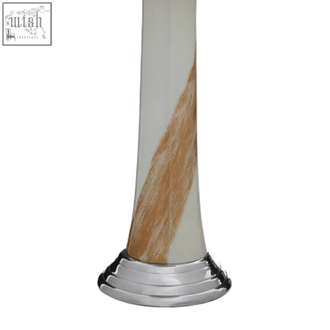 Alma white and gold candle holder with a sleek white body, amber swirl, and polished chrome gold candle base