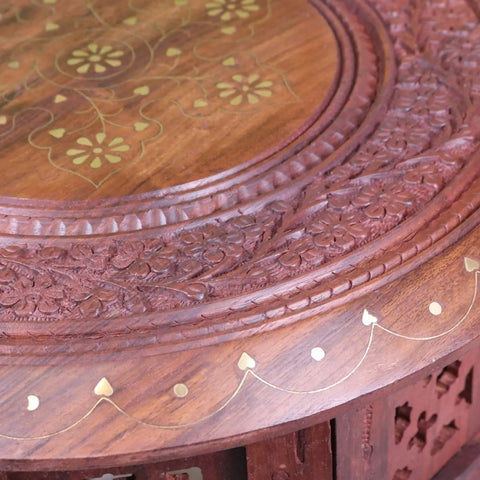 Rich mahogany alnif moroccan side table with intricate floral carvings and gold accents in sheesham wood