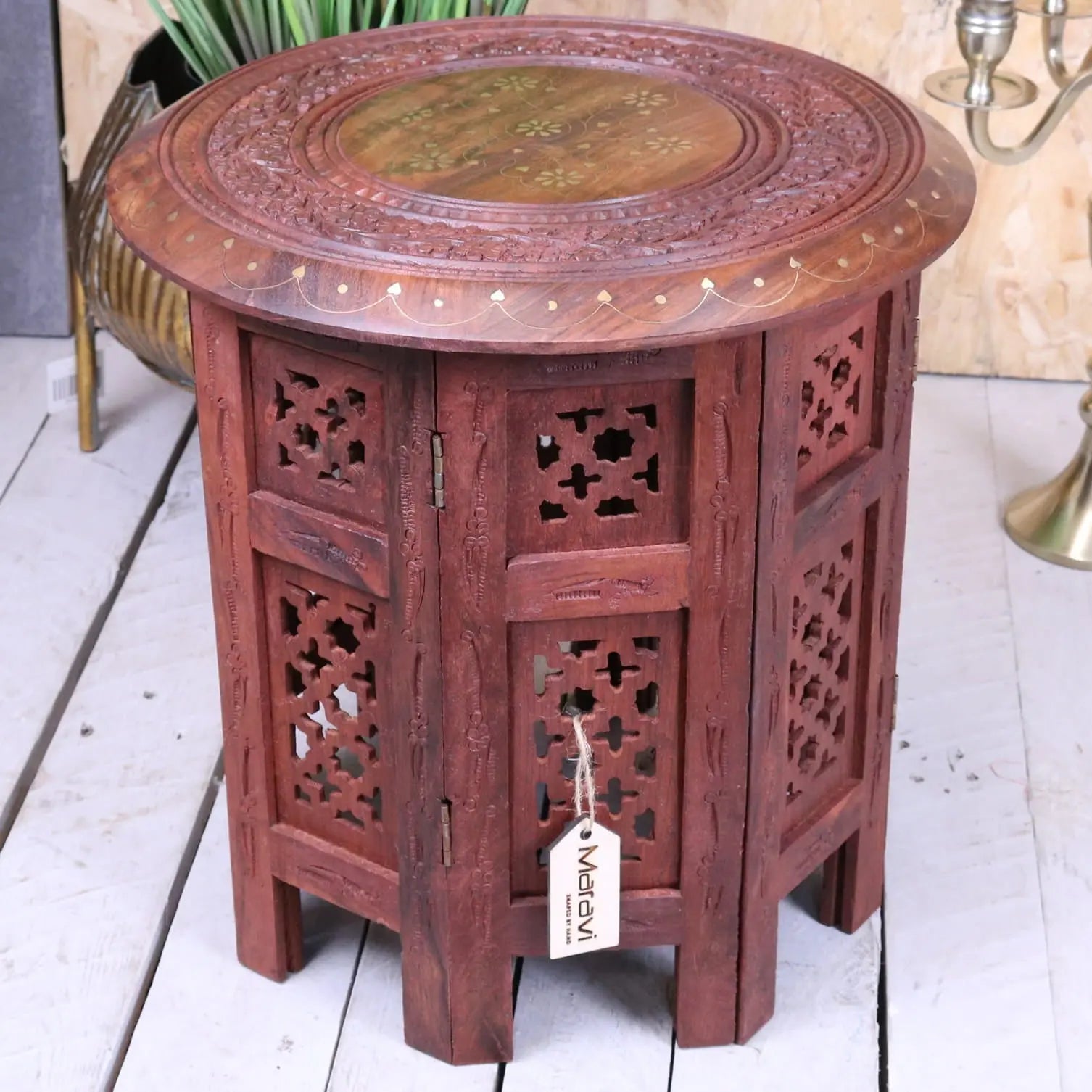 Alnif moroccan side table in reddish sheesham wood with intricate carvings and a circular lighter wood top inset