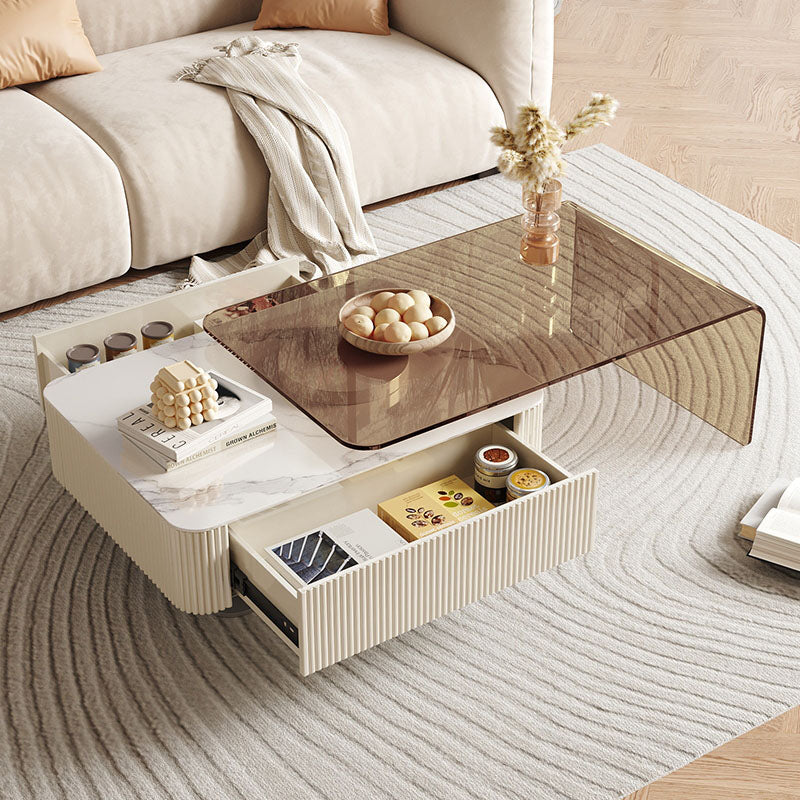 Modern cream-colored alonso coffee table with sintered stone marble top and ribbed sides with open storage drawers