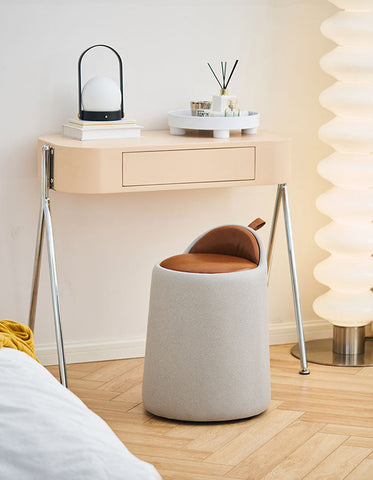 A modern alpha dressing table stool with a soft gray fabric body and warm brown pu leather seat