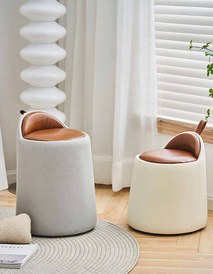 Two modern alpha dressing table stools with tan pu leather seats and light gray and cream fabric bases