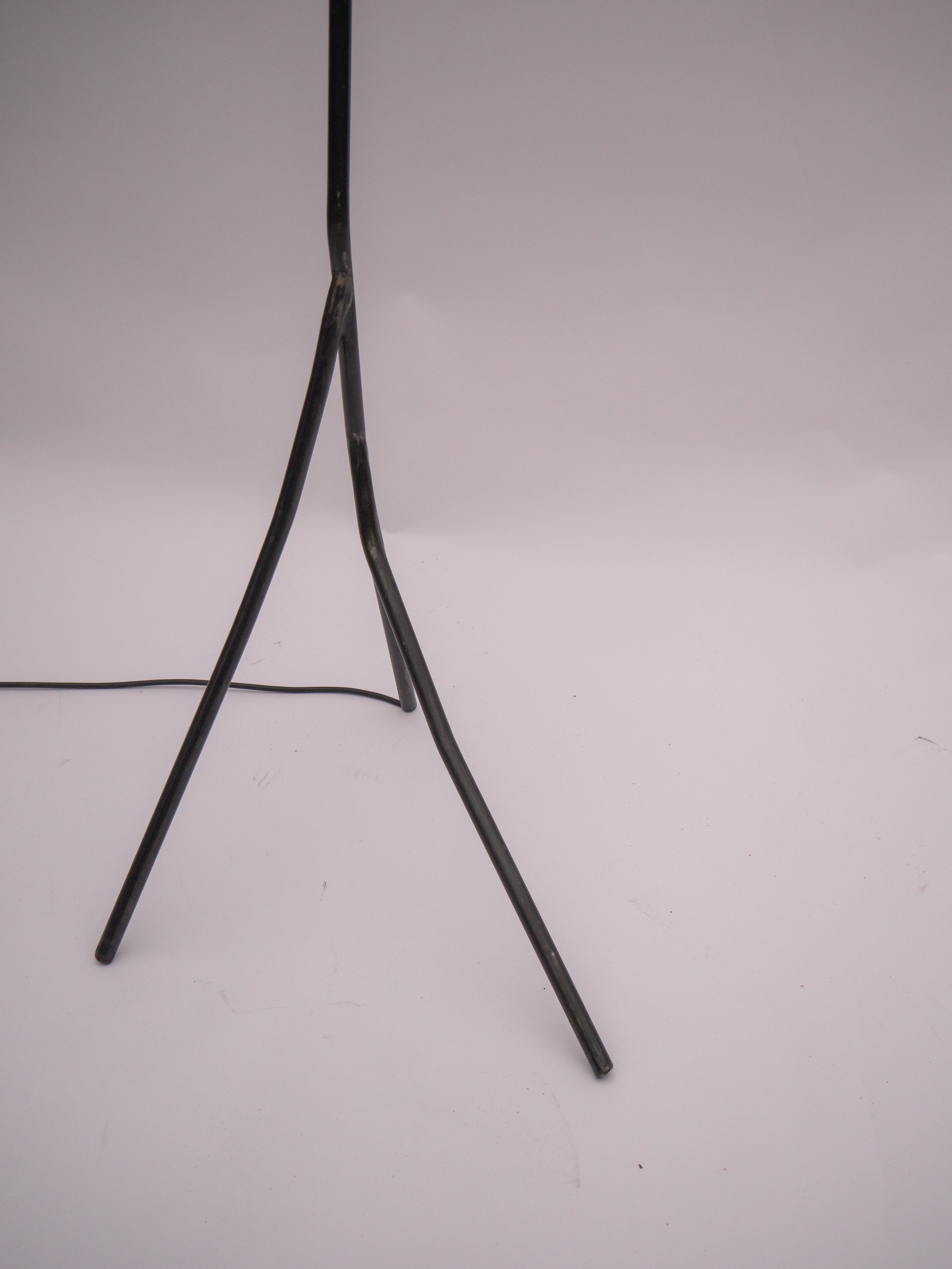 Black metal tripod stand with three angled legs and central support rod for aluminium balancing act floor lamp