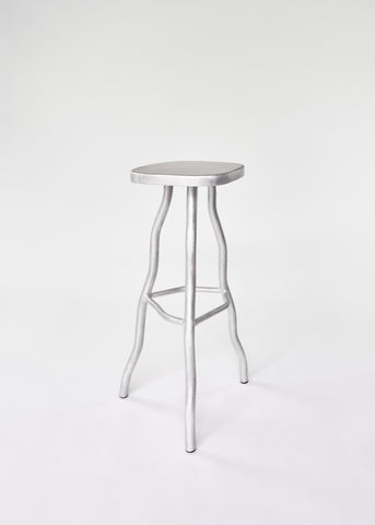Silver metallic aluminium bar stool with smooth rounded seat and organic tree like legs for stylish seating