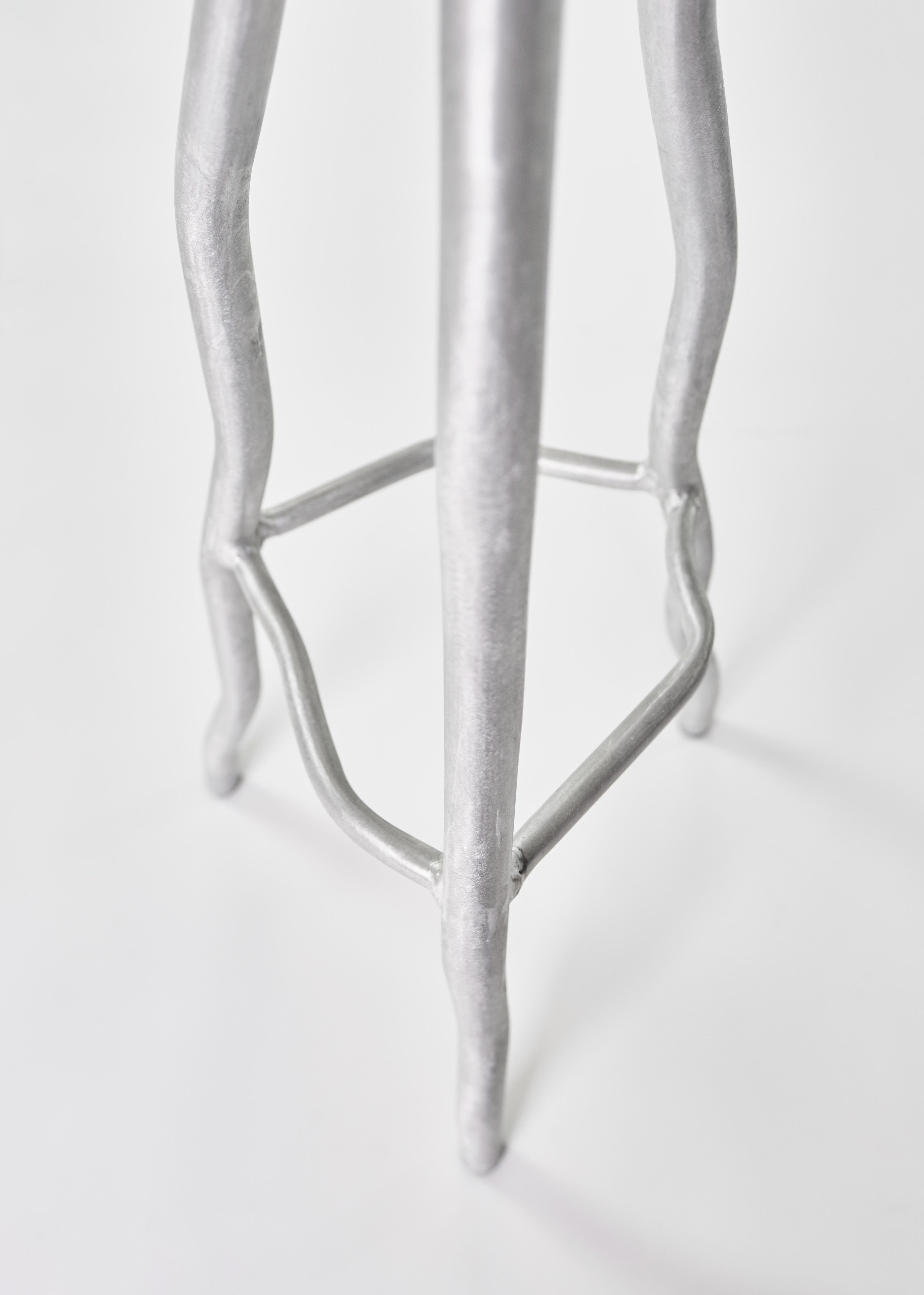 Silver metallic aluminium bar stool with sculpted organic leg design perfect for stylish seating