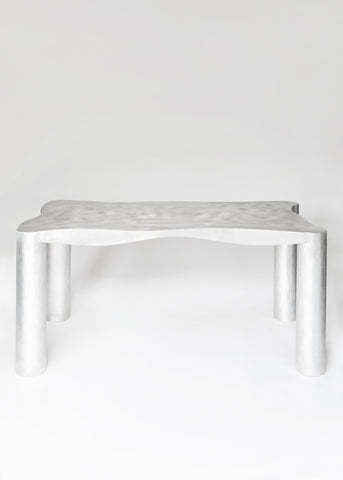 Silver metallic aluminium dining table with smooth textured top and cylindrical legs perfect for modern dining spaces
