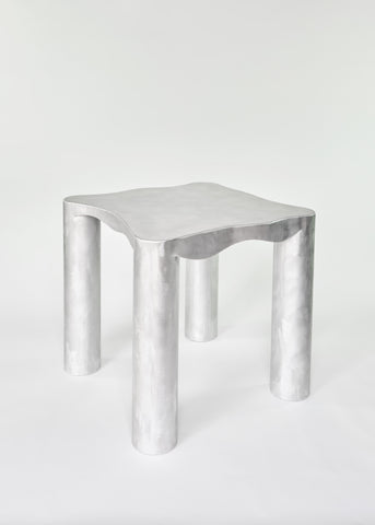Silver metallic aluminium kitchen table with smooth curved rectangular top and four cylindrical legs