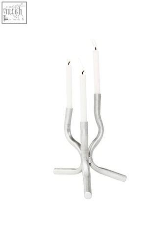 Silver metallic aluminium mini candelabra with three slender curved arms holding white candles