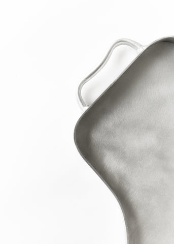 Silver metallic aluminium serving tray with smooth textured surface and rounded edges perfect for serving food