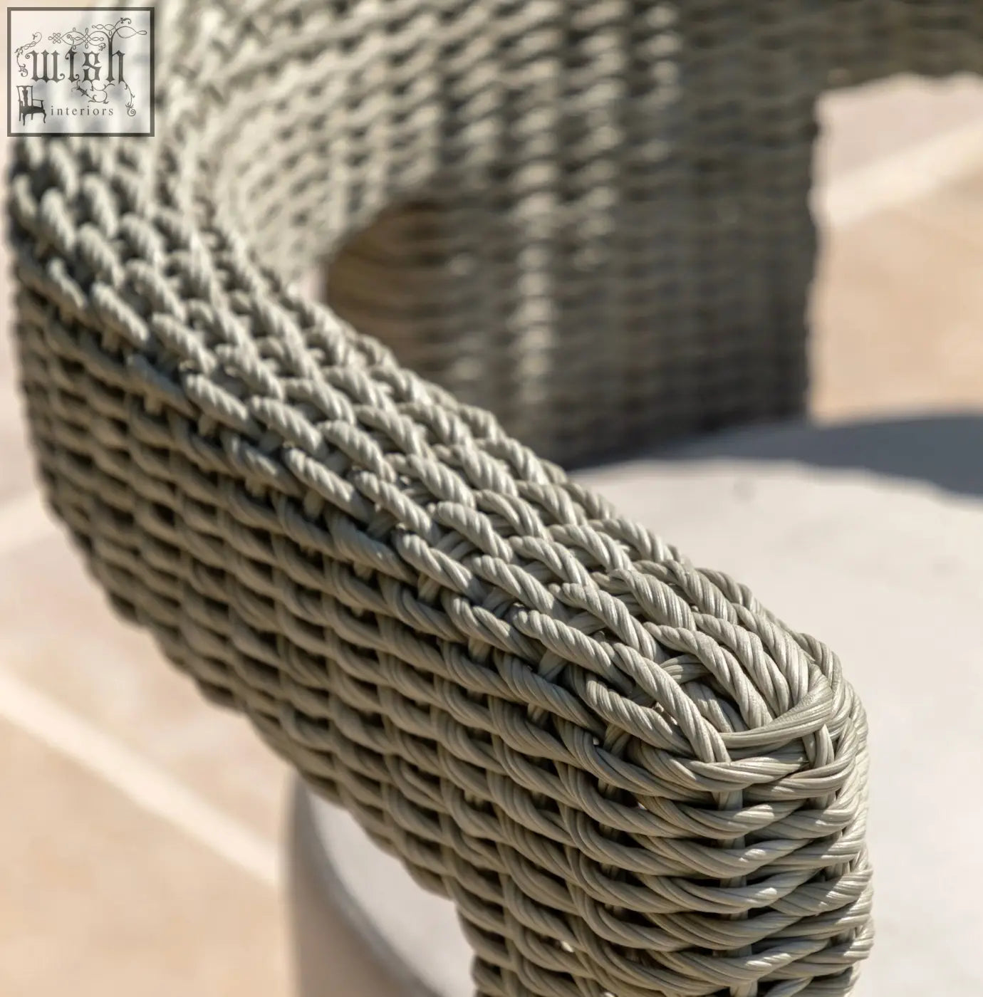 Gray woven wicker resin armrest with tight interlaced pattern on alva chair x 2 featuring material steel frame