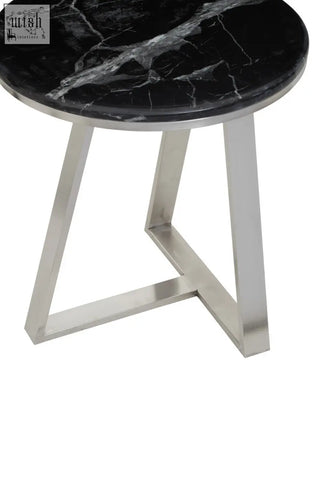 Alvaro round side table with black marble top and silver sledge base perfect for stylish living spaces
