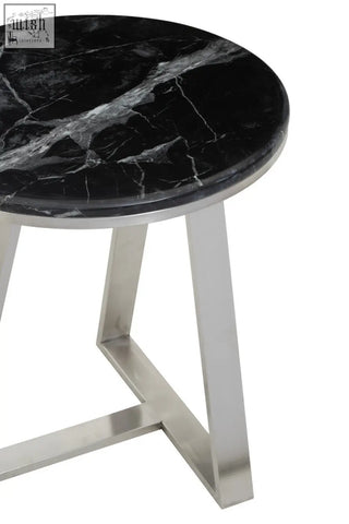 Alvaro round side table with black marble top and silver sledge base in sleek polished stainless steel legs